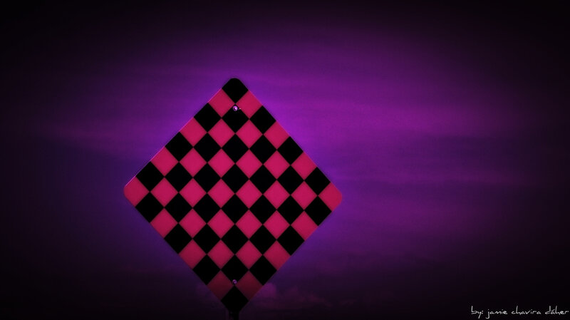 checkered sign at night