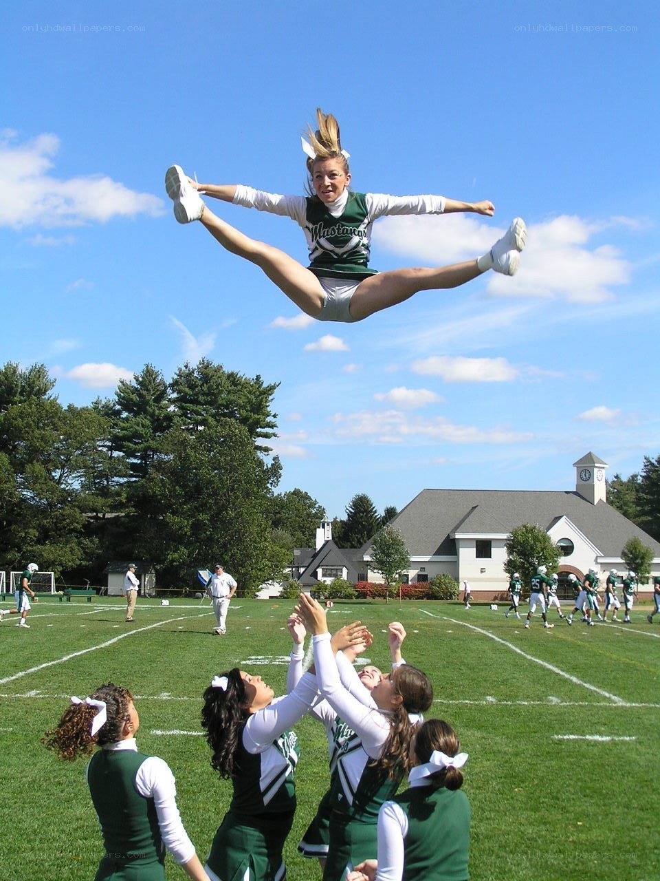 Cheerleader in mid-air jump