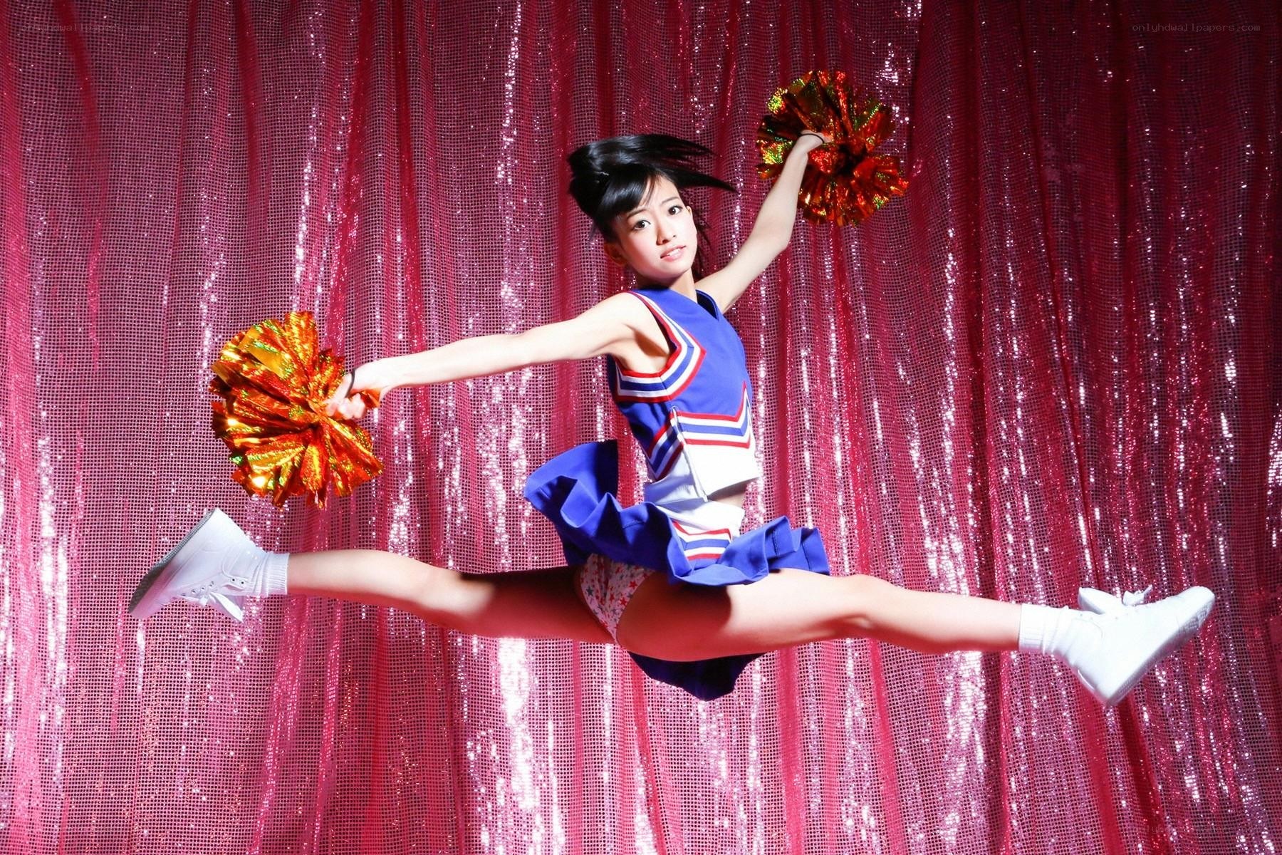 cheerleader in mid-jump