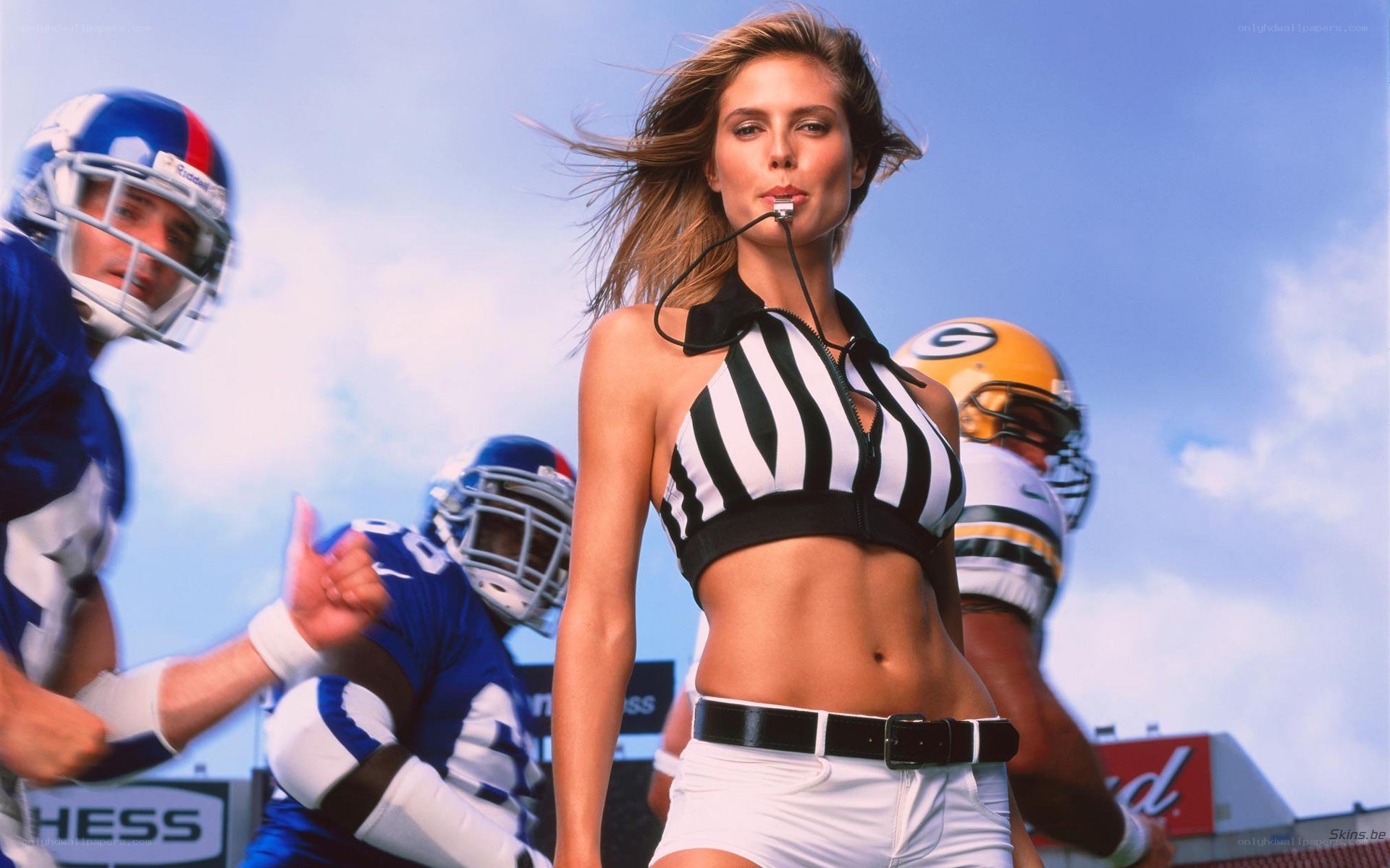 cheerleader in referee uniform