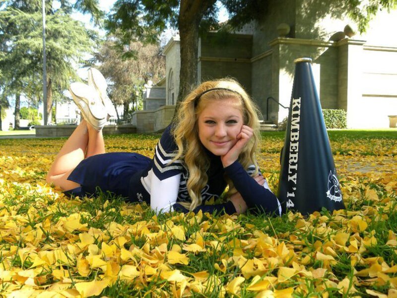 Cheerleader Lying on Grass