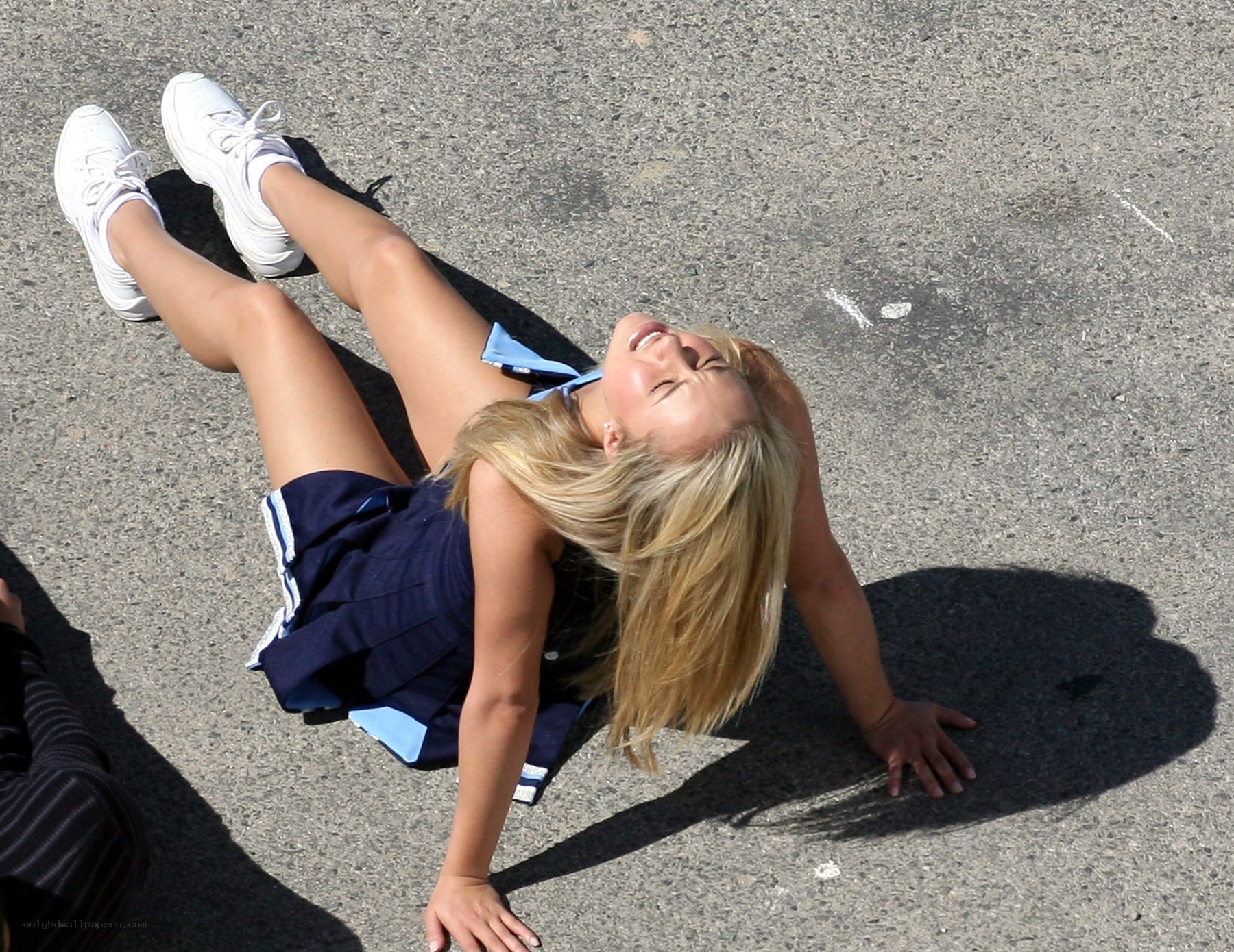 Cheerleader on the ground
