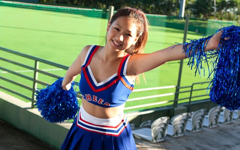 Cheerleader with pom-poms