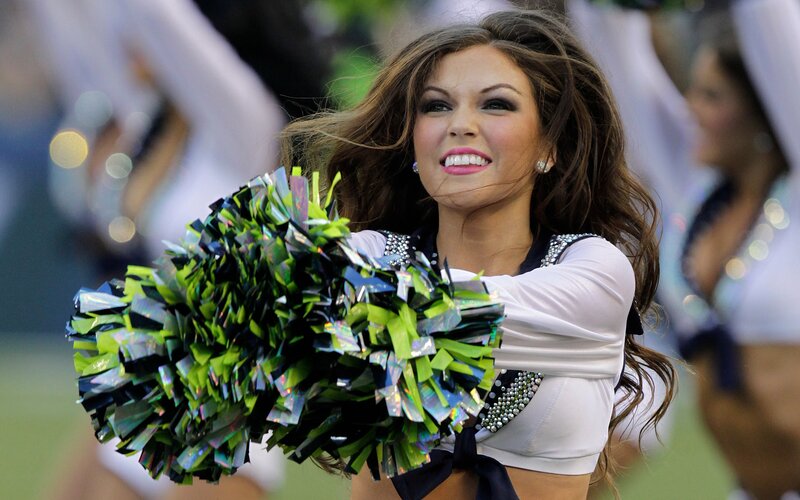 Cheerleader with pom-poms