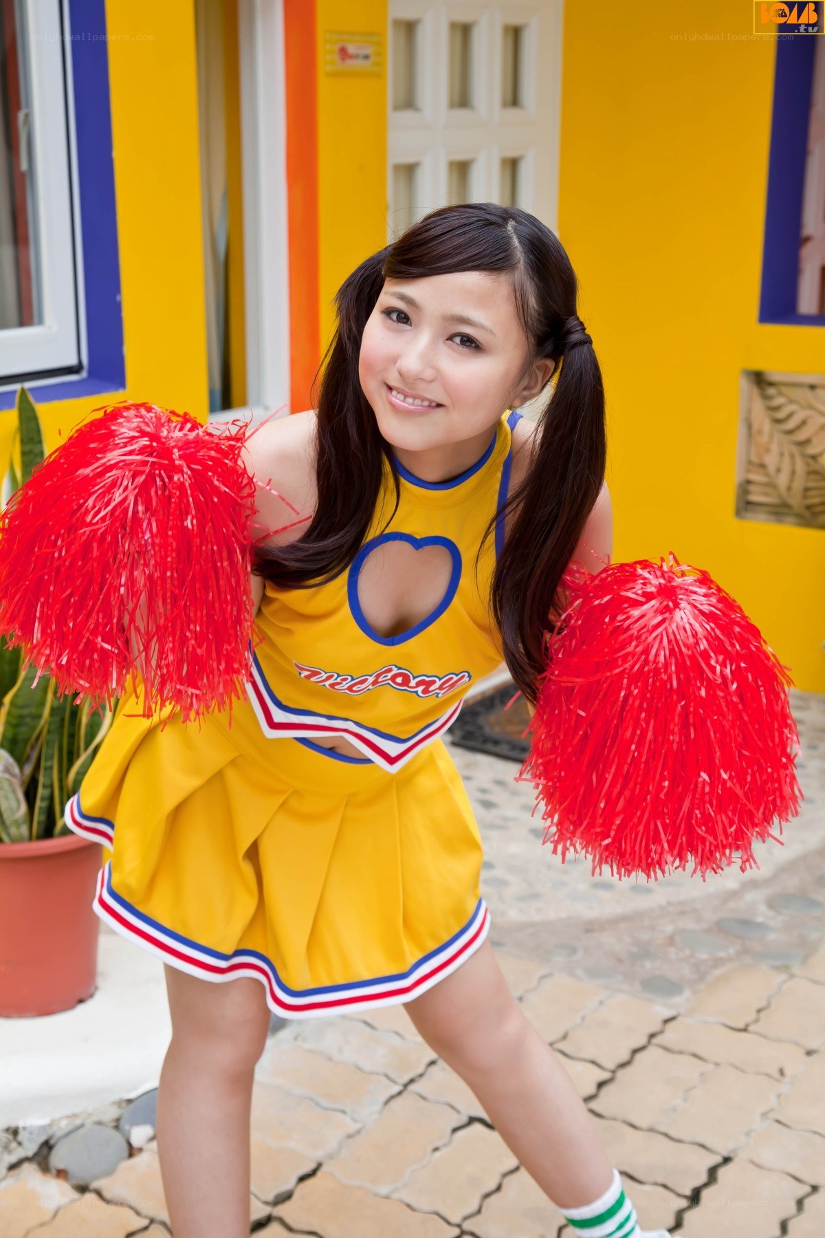 cheerleader with pom-poms