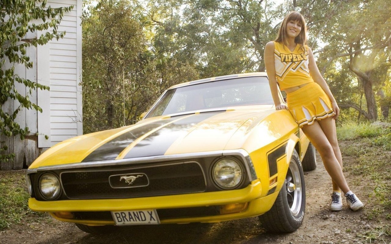 cheerleader with yellow car