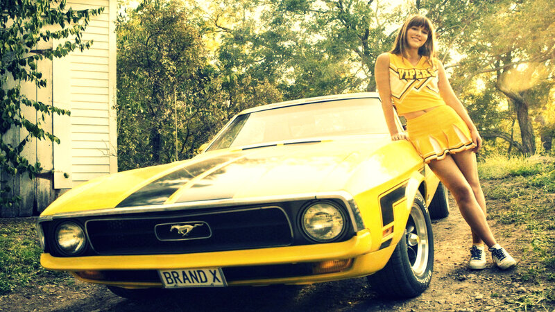 cheerleader with yellow mustang