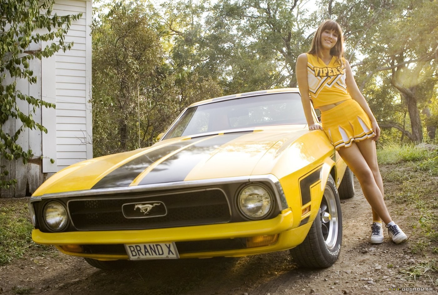 cheerleader with yellow mustang