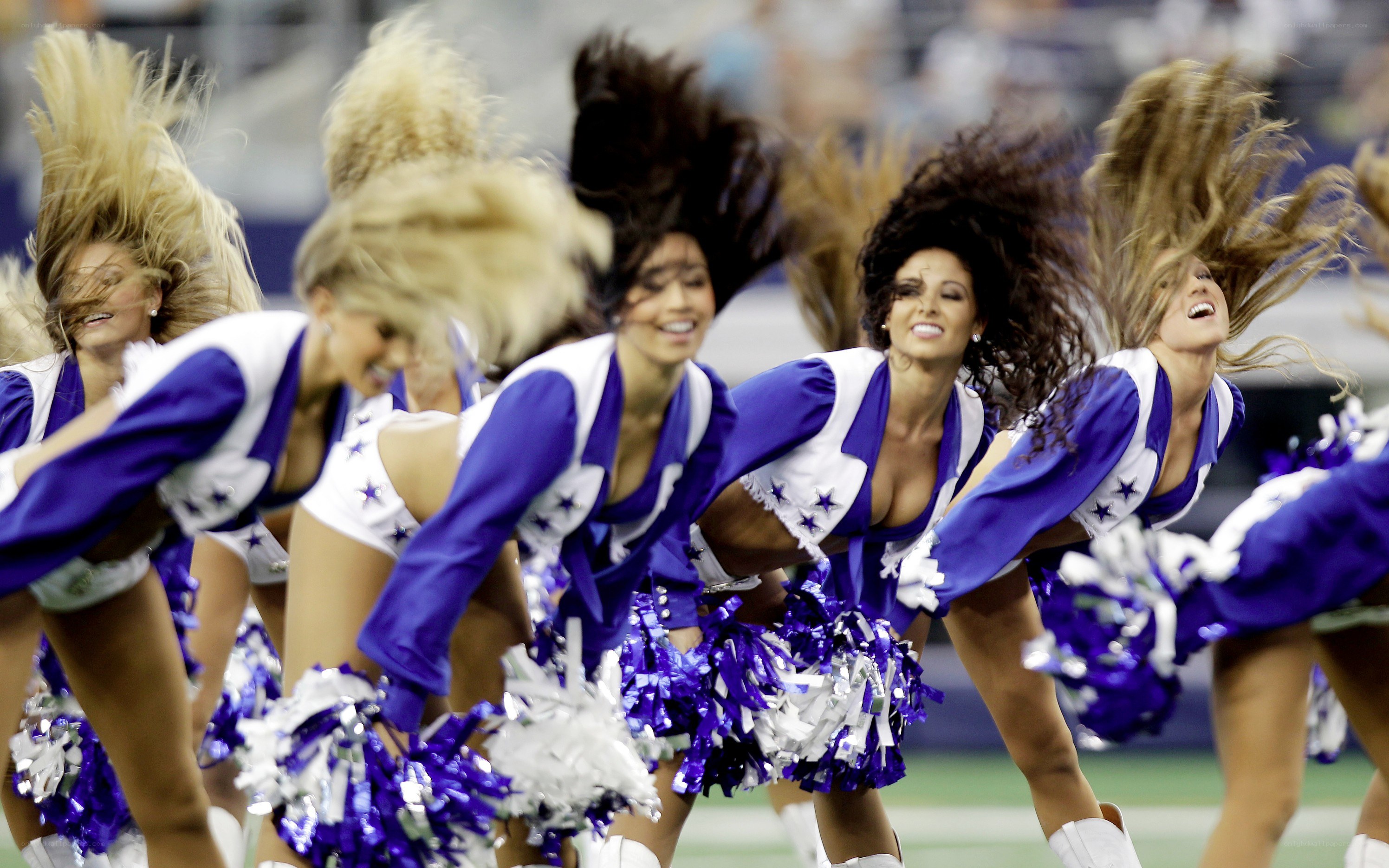 Cheerleaders performing on field