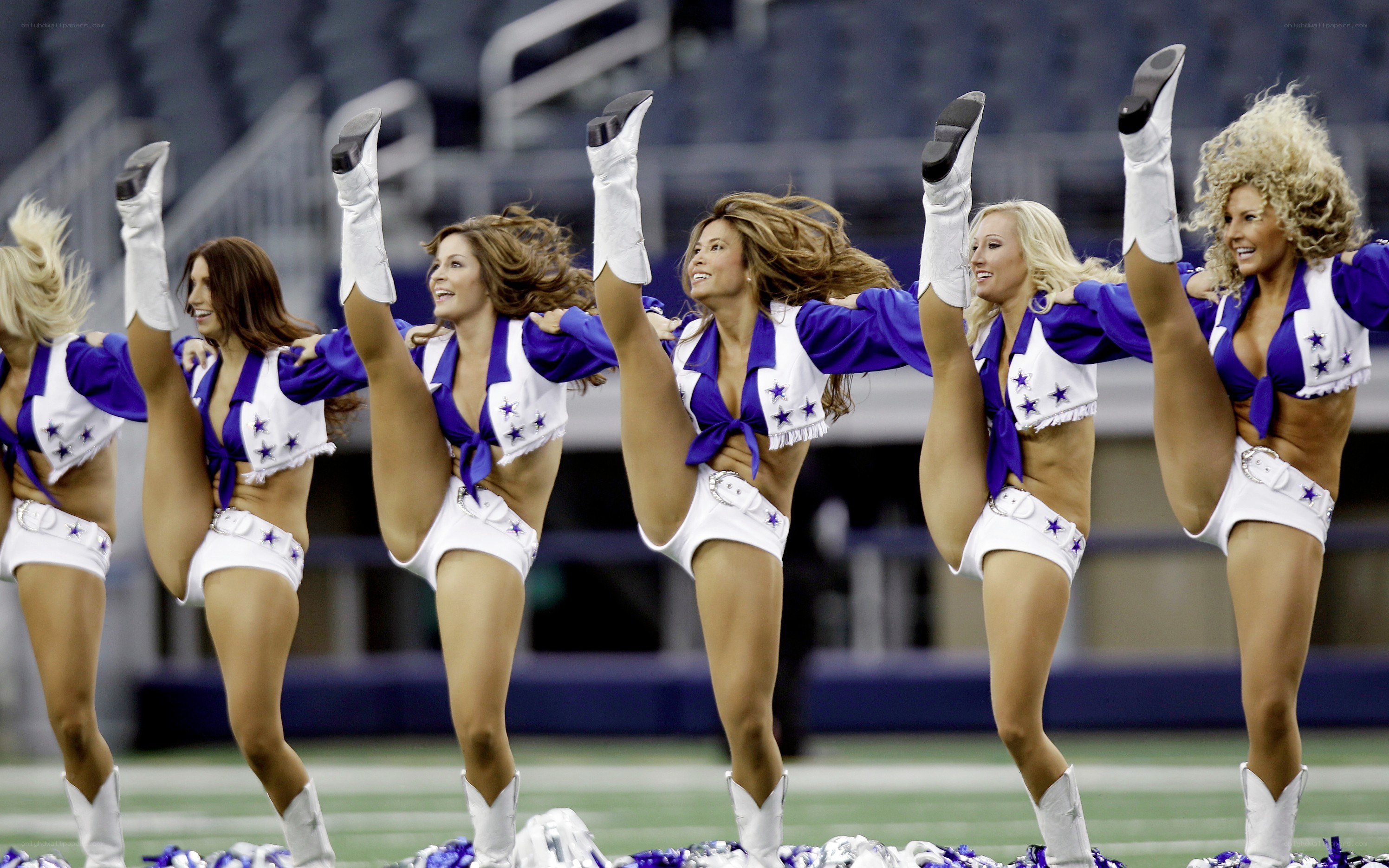 Cheerleaders performing on field