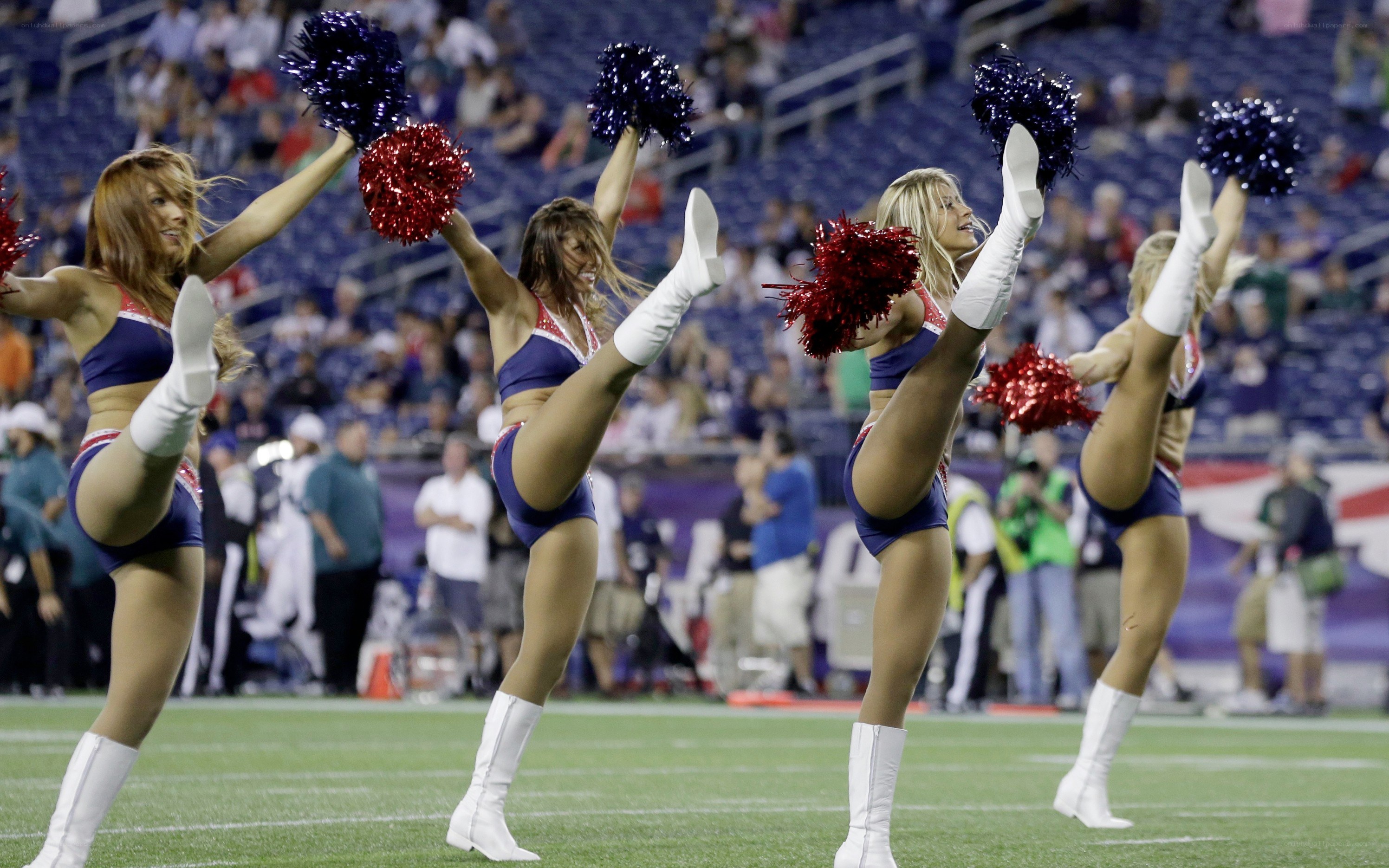 Cheerleaders performing on field