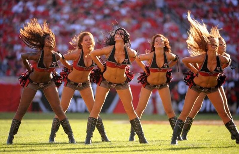 cheerleaders performing on field