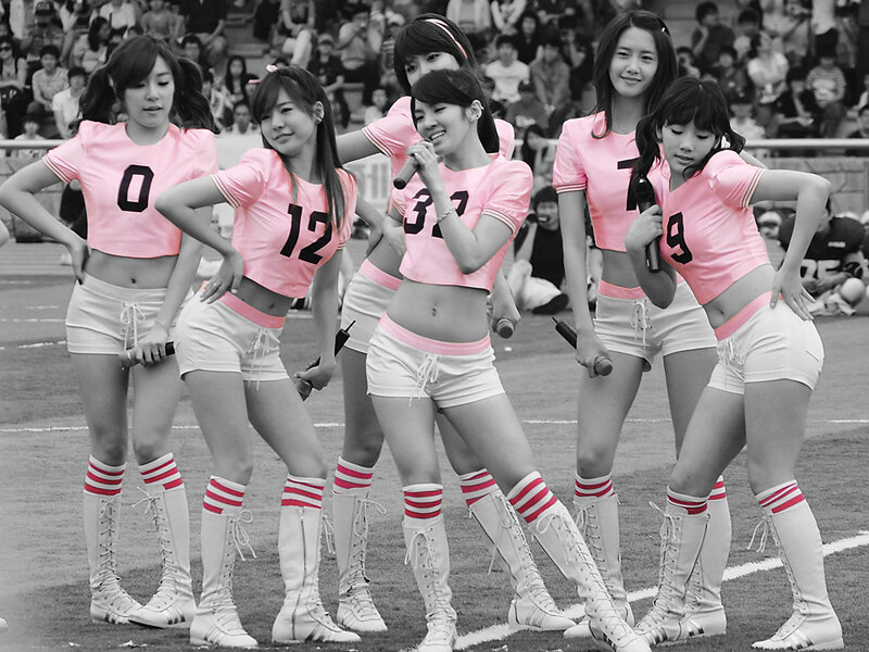 Cheerleaders performing on field