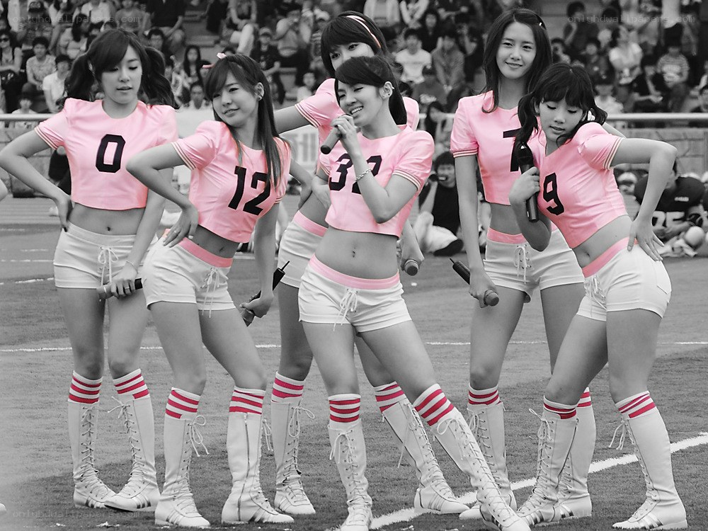 Cheerleaders performing on field