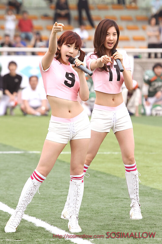 Cheerleaders performing on field