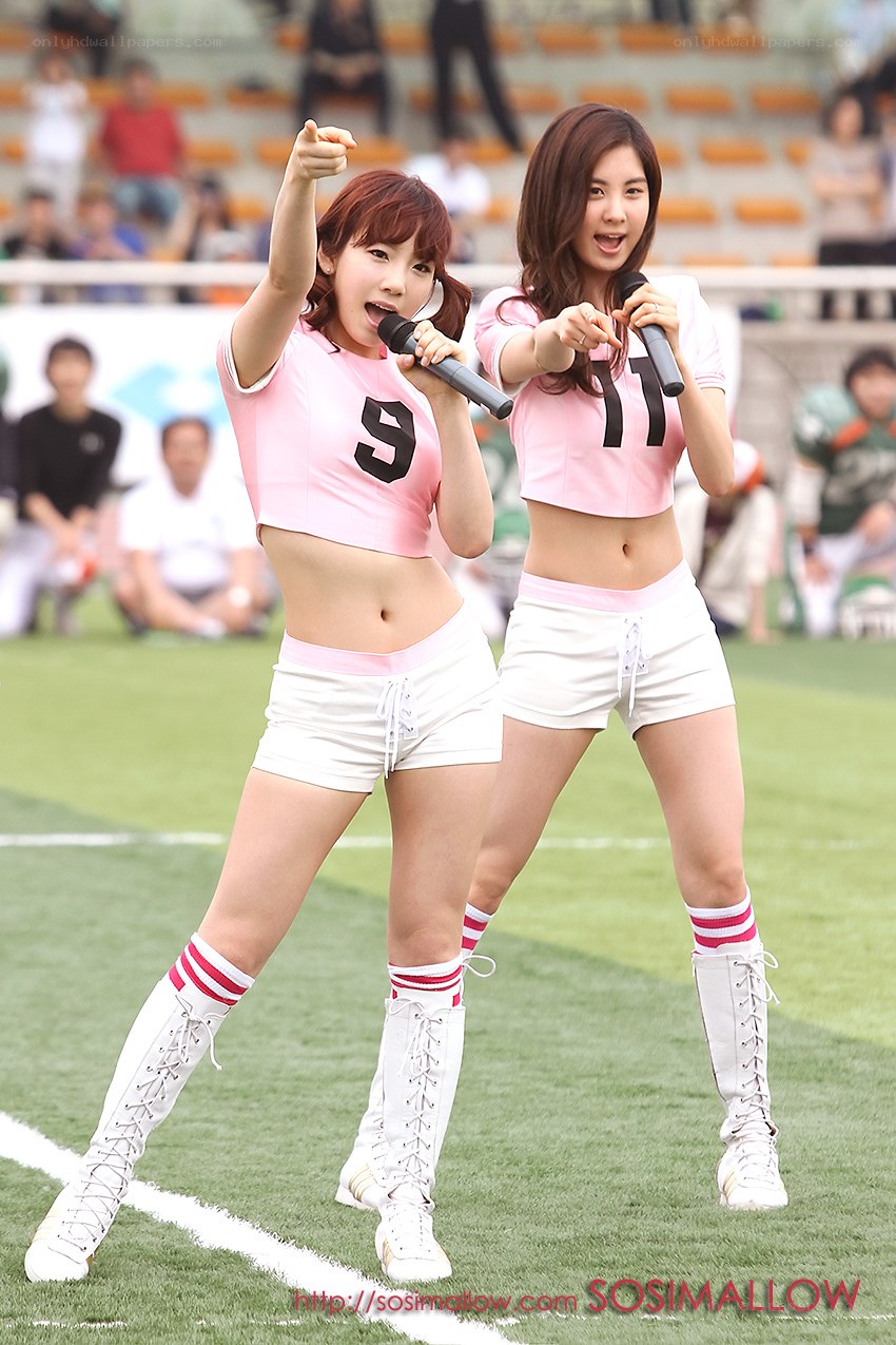 Cheerleaders performing on field