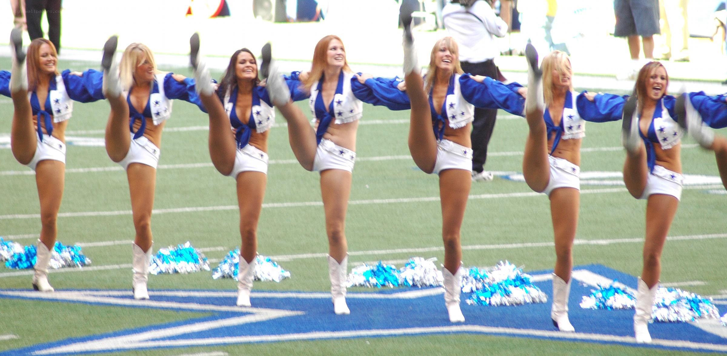 Cheerleaders performing on field