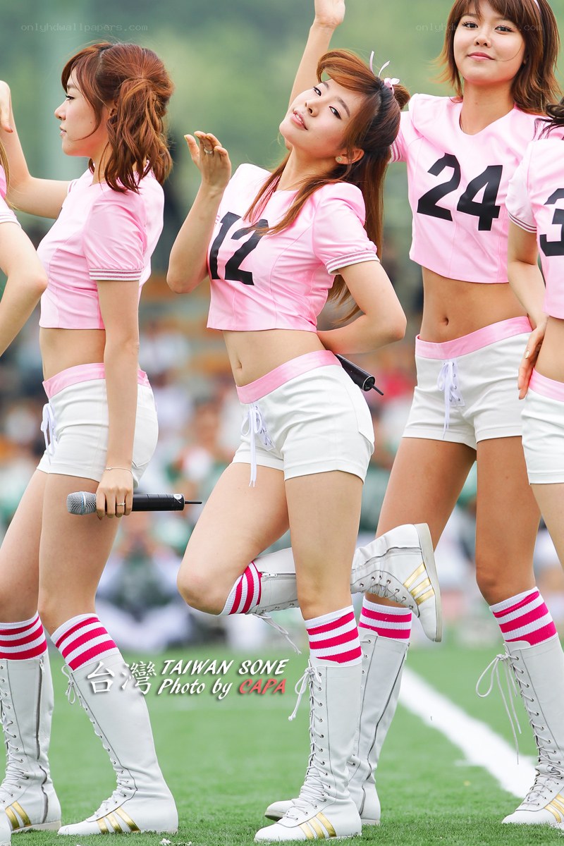 Cheerleaders performing on field