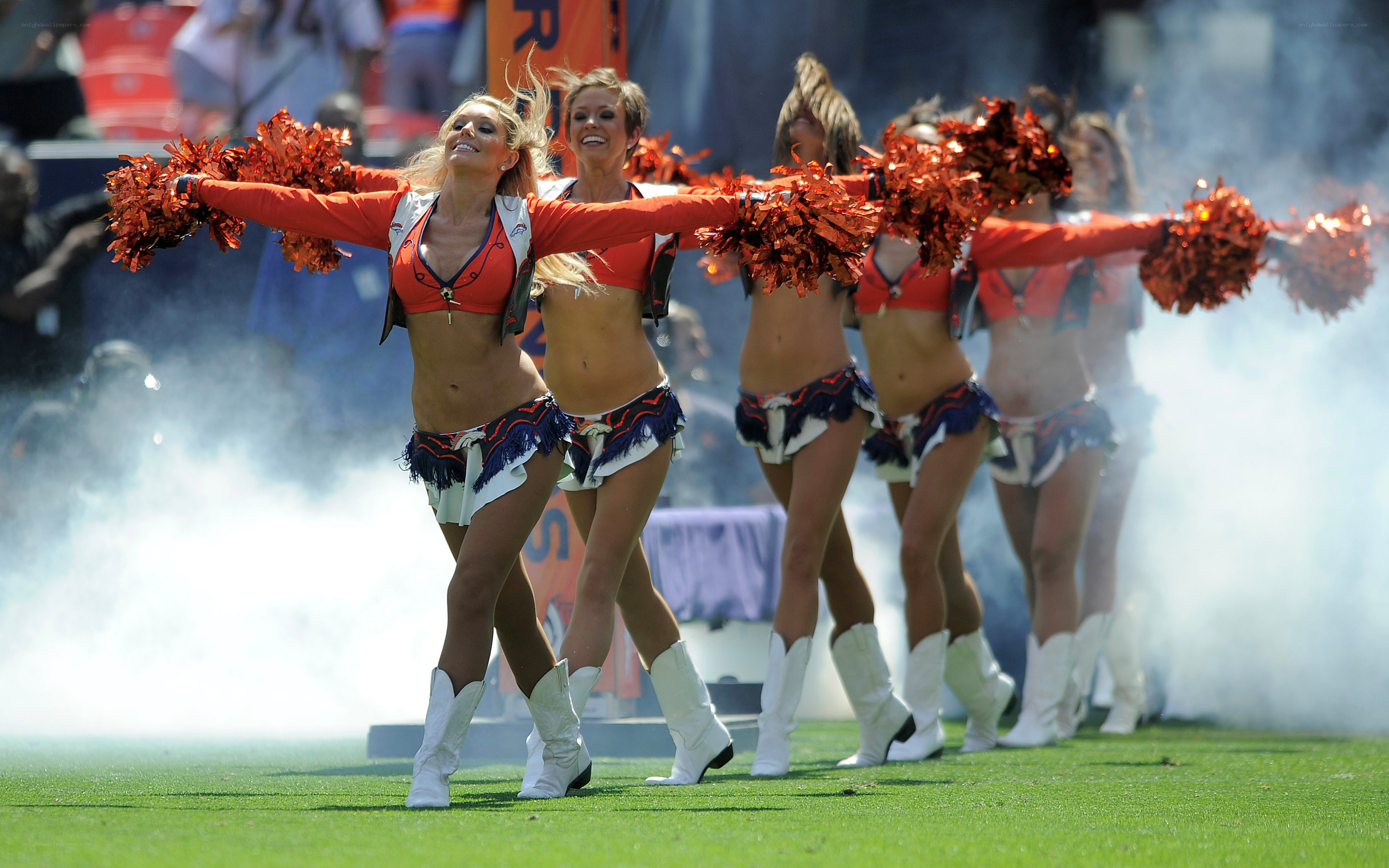 Cheerleaders performing on field