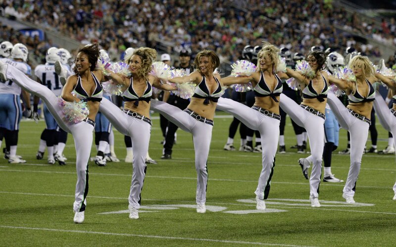 Cheerleaders performing on field