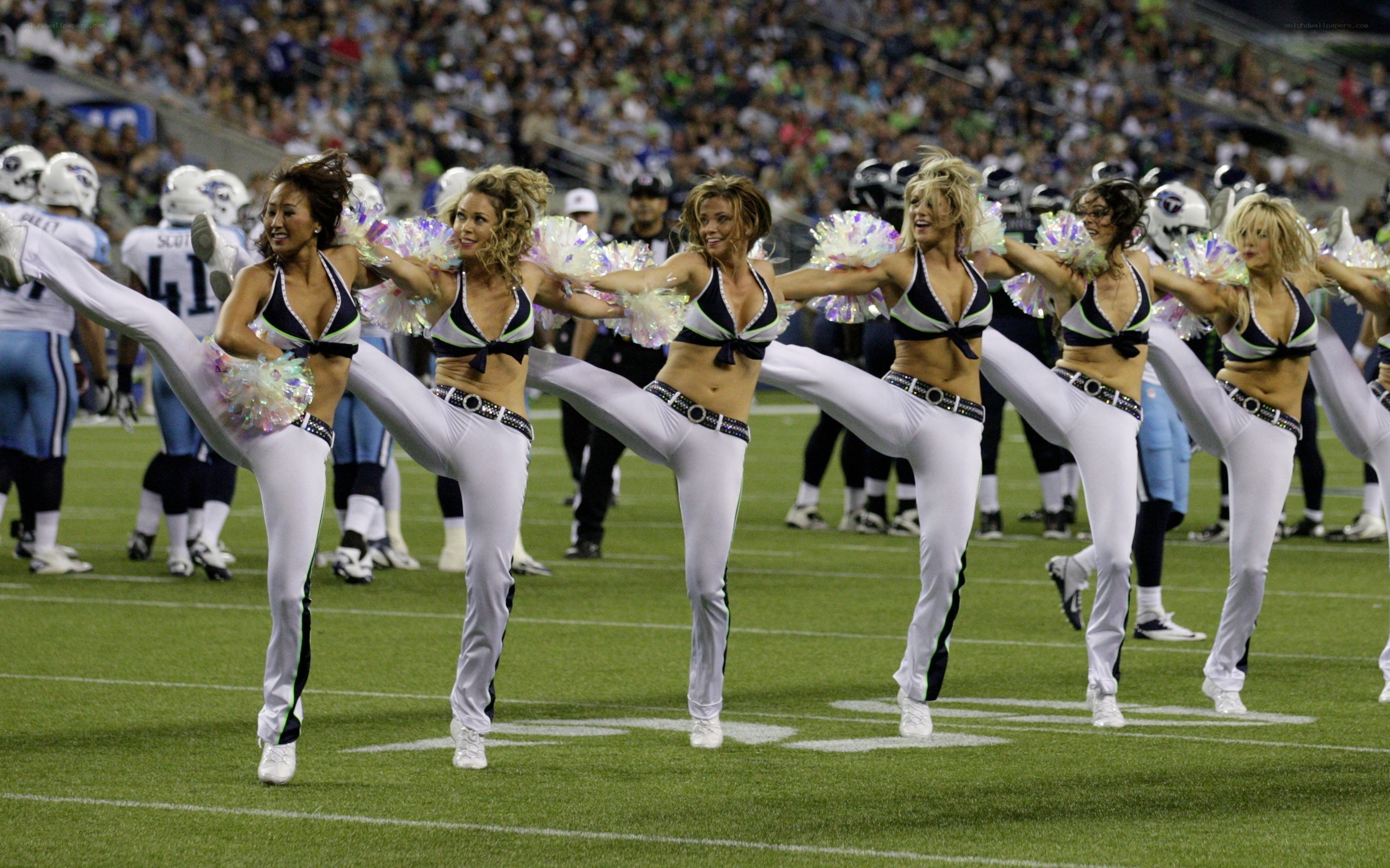 Cheerleaders performing on field