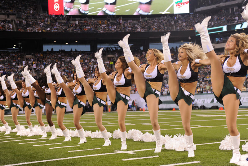 Cheerleaders Performing on Field — Green, Energetic