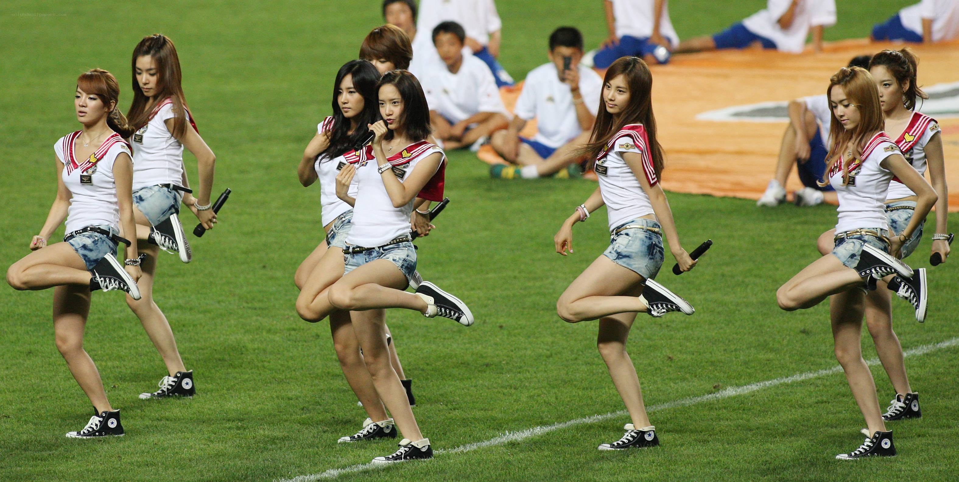 Cheerleaders performing on field