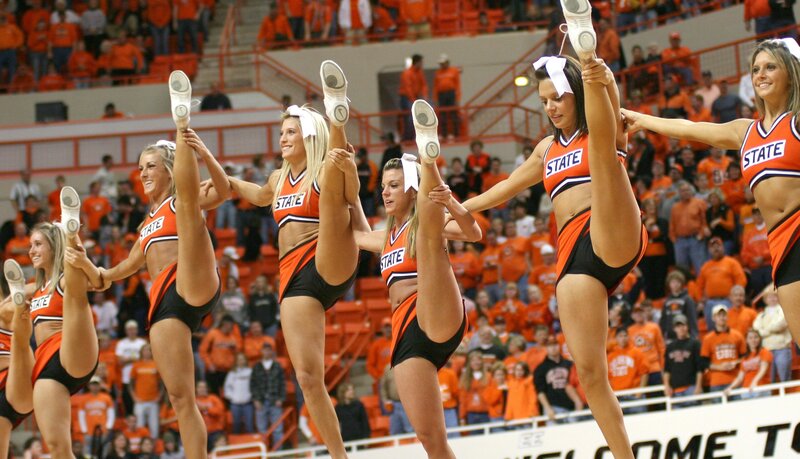 Cheerleaders Performing Routine — Orange, Energetic, Afternoon