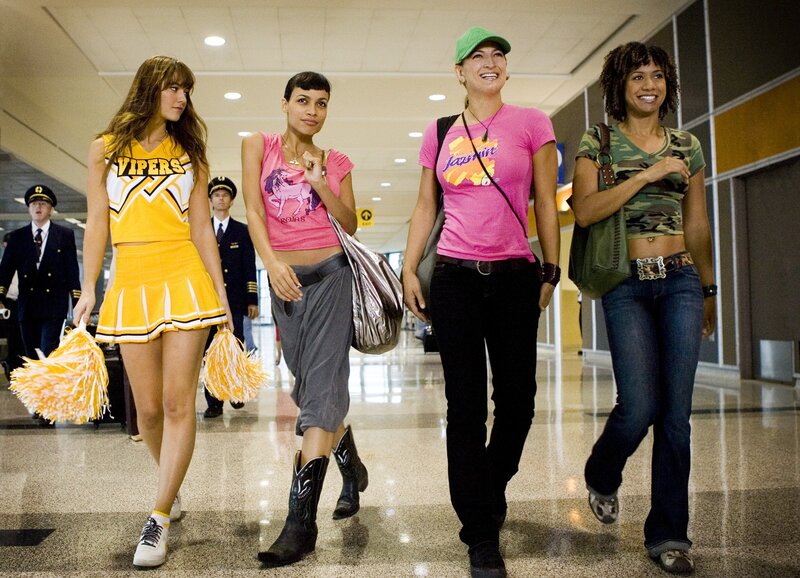 cheerleaders walking in airport