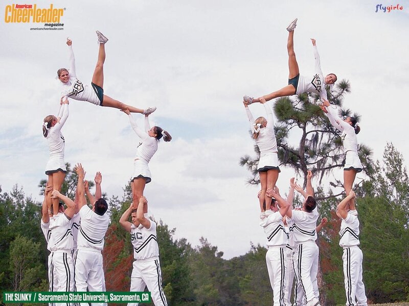 Cheerleading team performing stunt