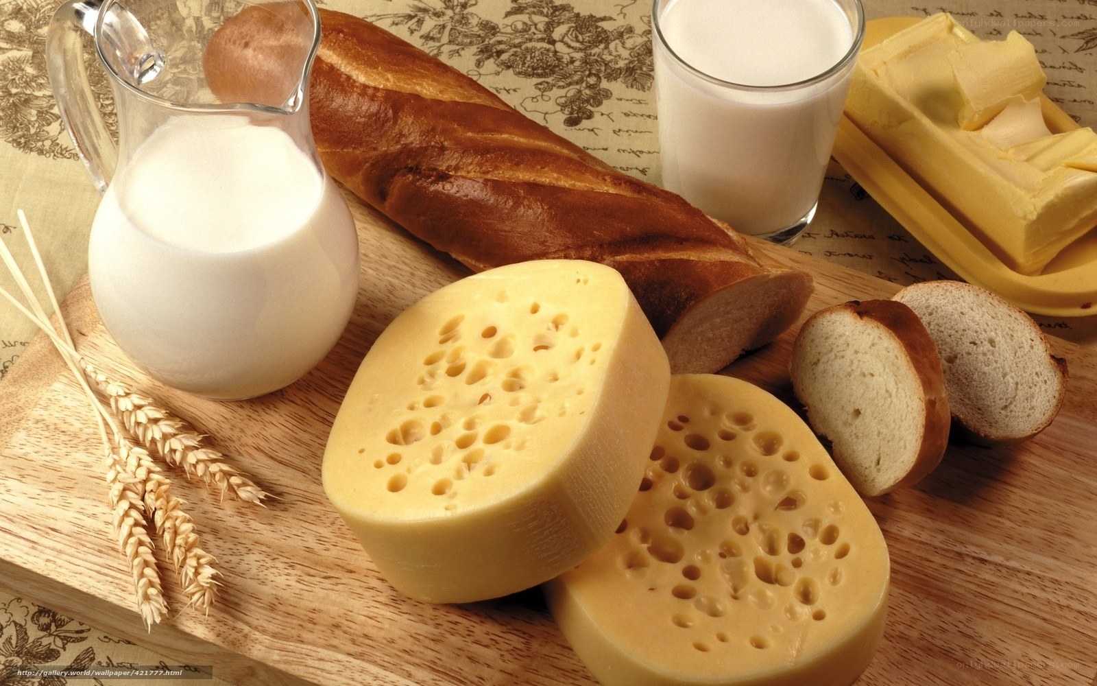 cheese and bread on wooden board