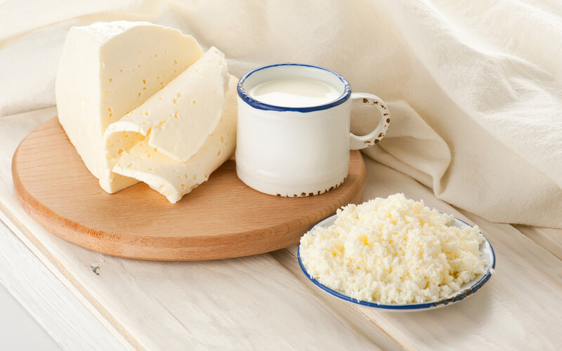 Cheese and Milk on Wood