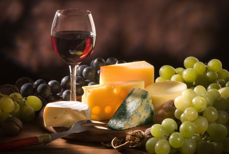 Cheese and Wine Platter — Brown, Dramatic, Photograph, Grapes, Nuts, Wine Glass, Yellow