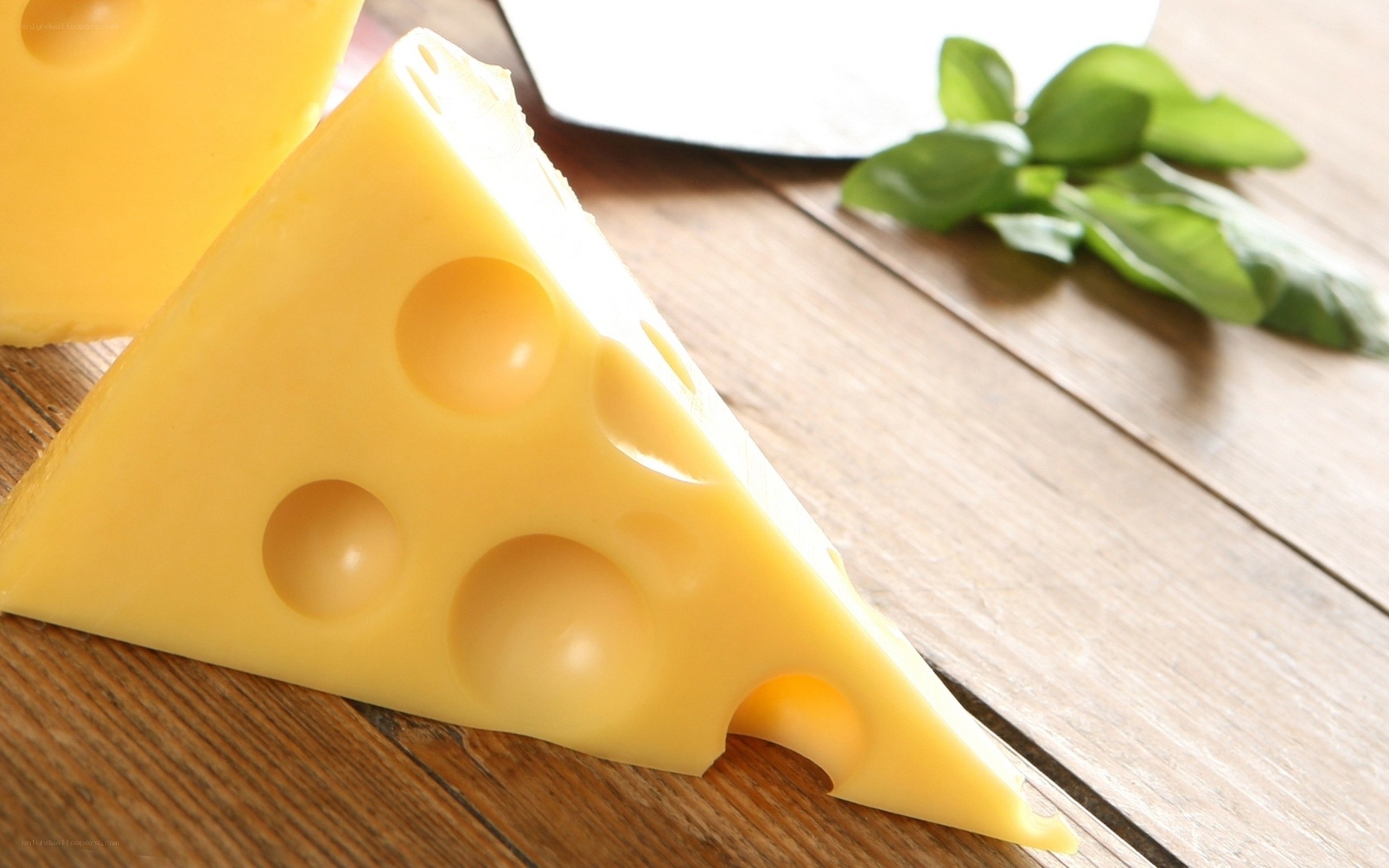 cheese wedge on wooden table