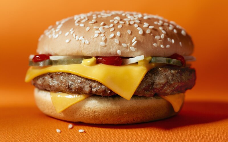 cheeseburger on orange background