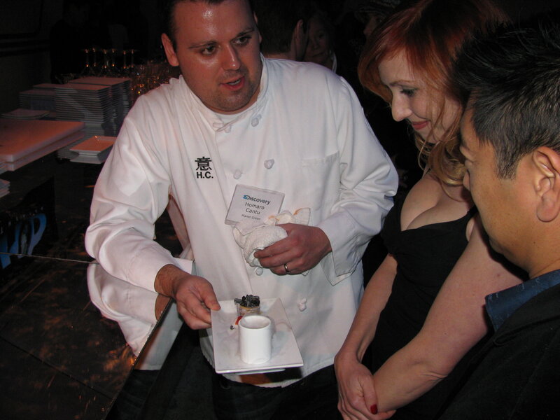 Chef serving dessert to guests