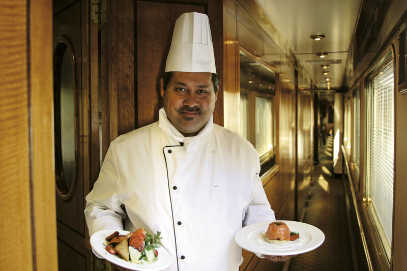 Chef serving meals on a train