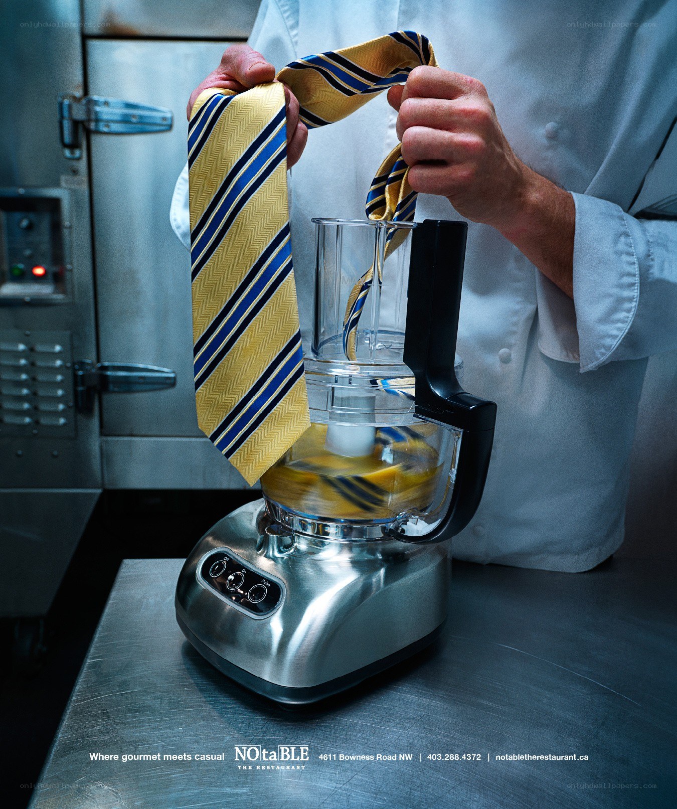 Chef using food processor with tie