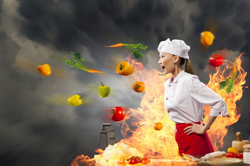 Chef with flying vegetables