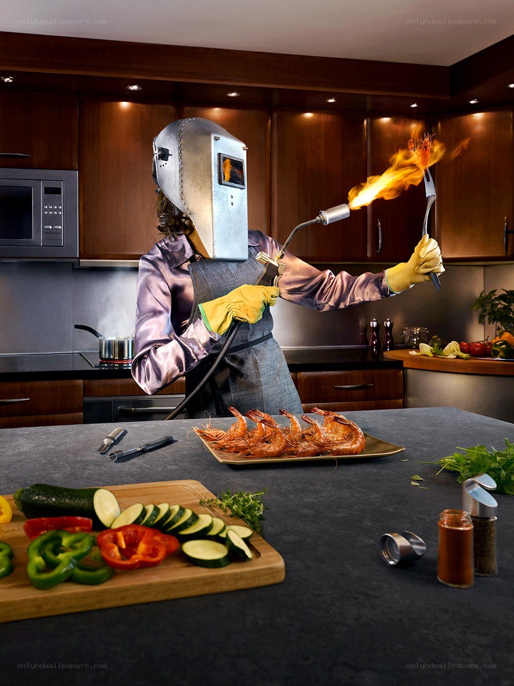 Chef with welding mask cooking shrimp
