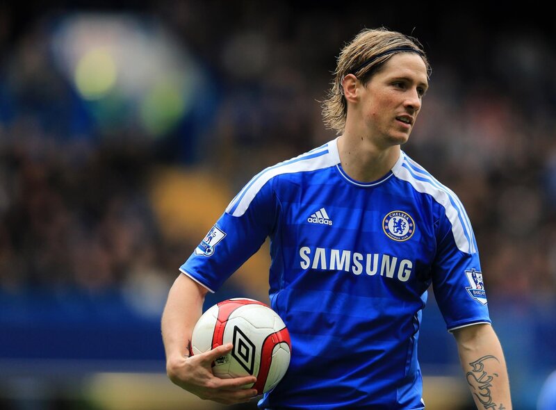 Chelsea football player holding ball