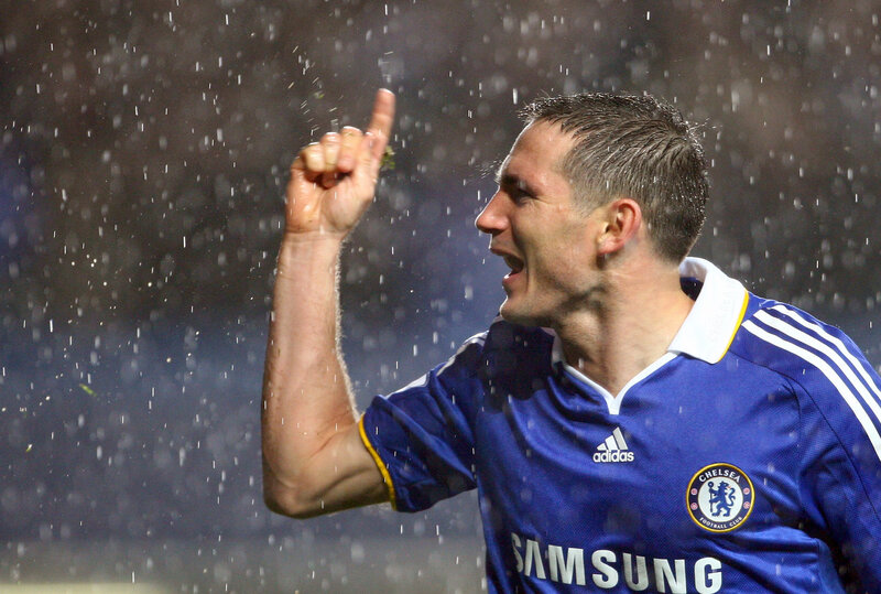 Chelsea player celebrating in rain