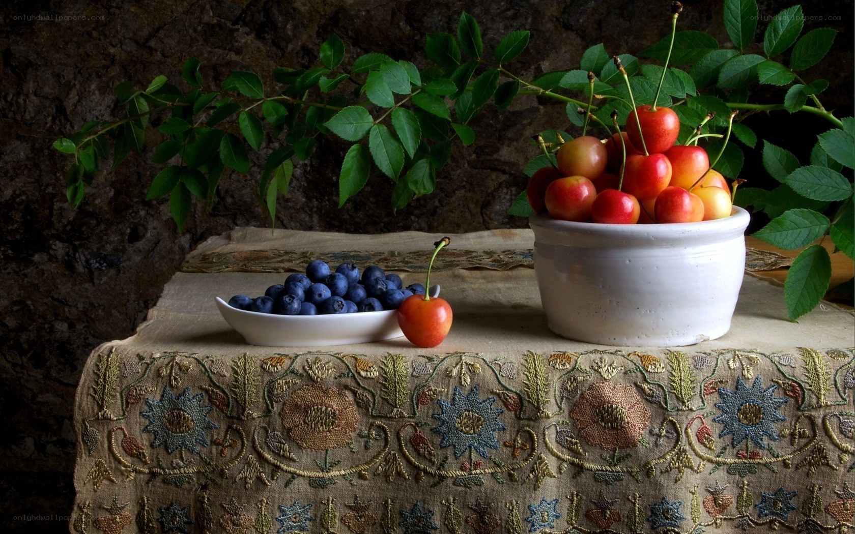 Cherries and blueberries on table