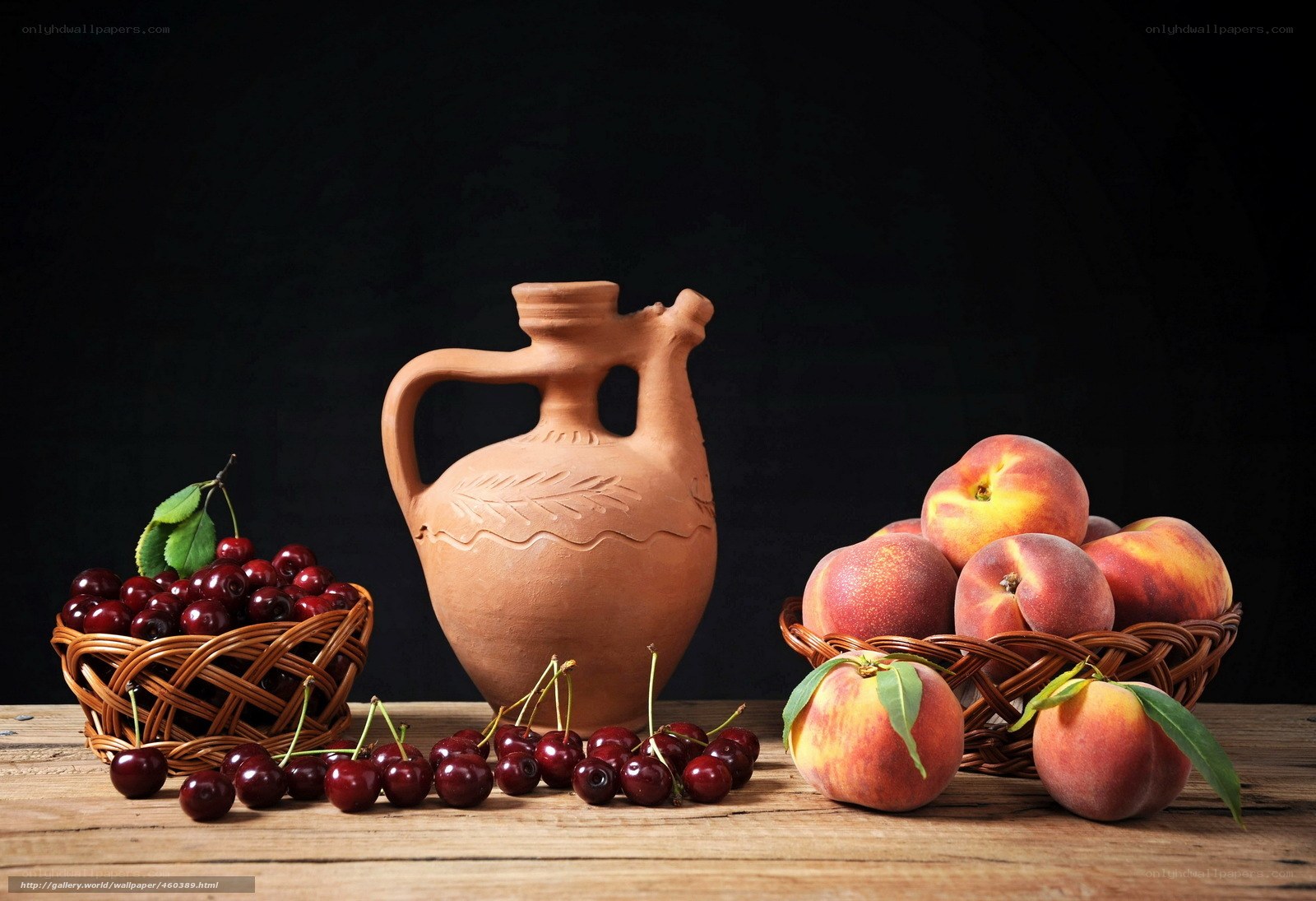 Cherries and peaches on wood