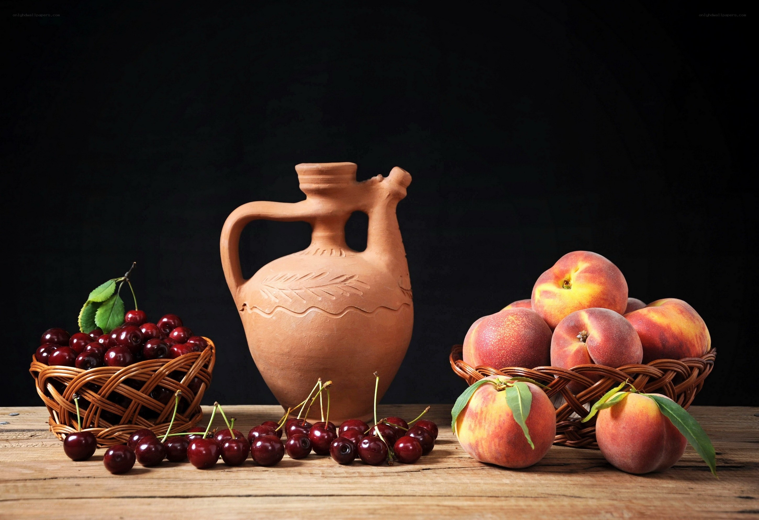 Cherries and peaches with clay jug