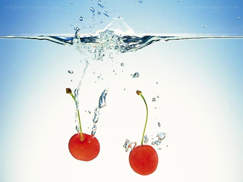 cherries falling into water