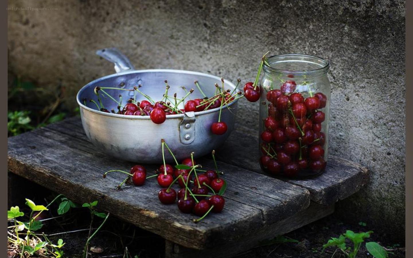 Cherries in a pan and jar