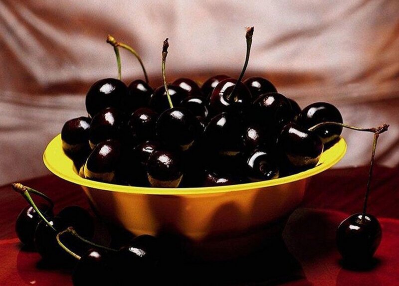 Cherries in a yellow bowl