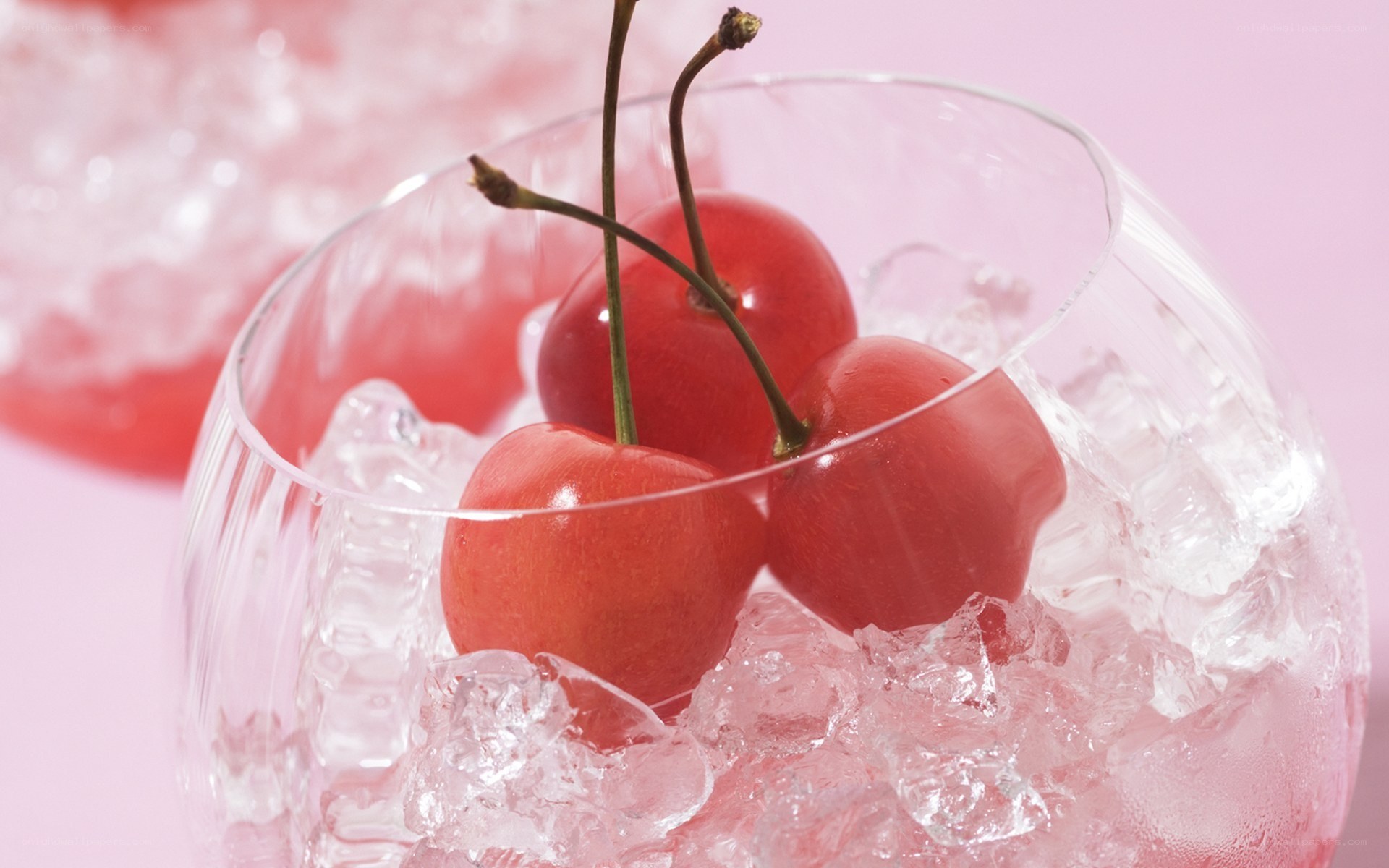 cherries in ice with glass