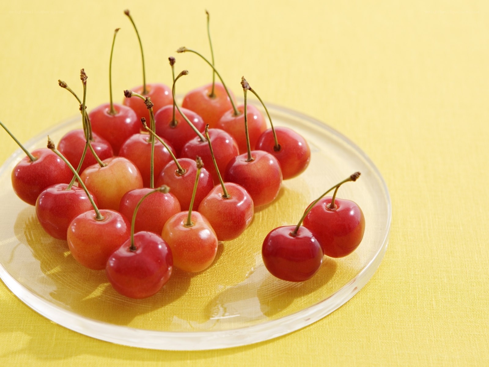 Cherries on a glass plate
